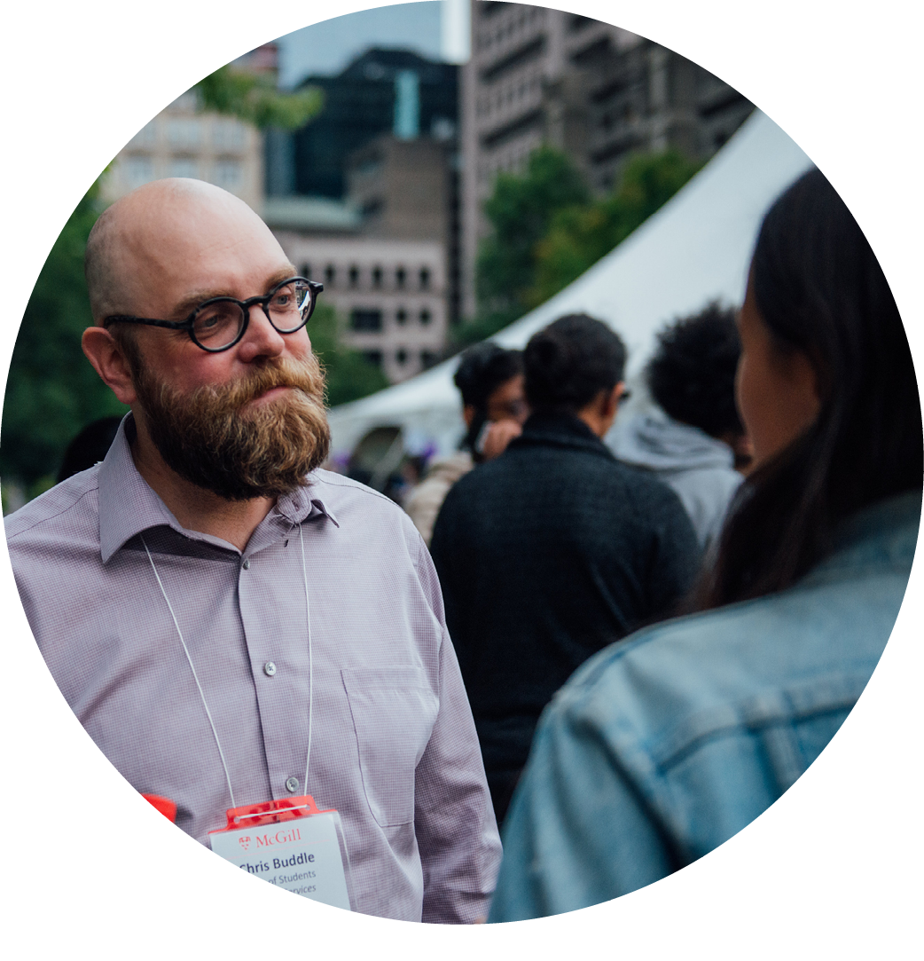 Dean of Students, Professor Chris Buddle, talks with a McGill student