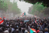 People take to streets in Sudan after the October 2021 coup