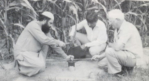 Three participants of the 1987 Drainage course working together in the field.