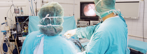 Doctors performing minimally invasive surgery