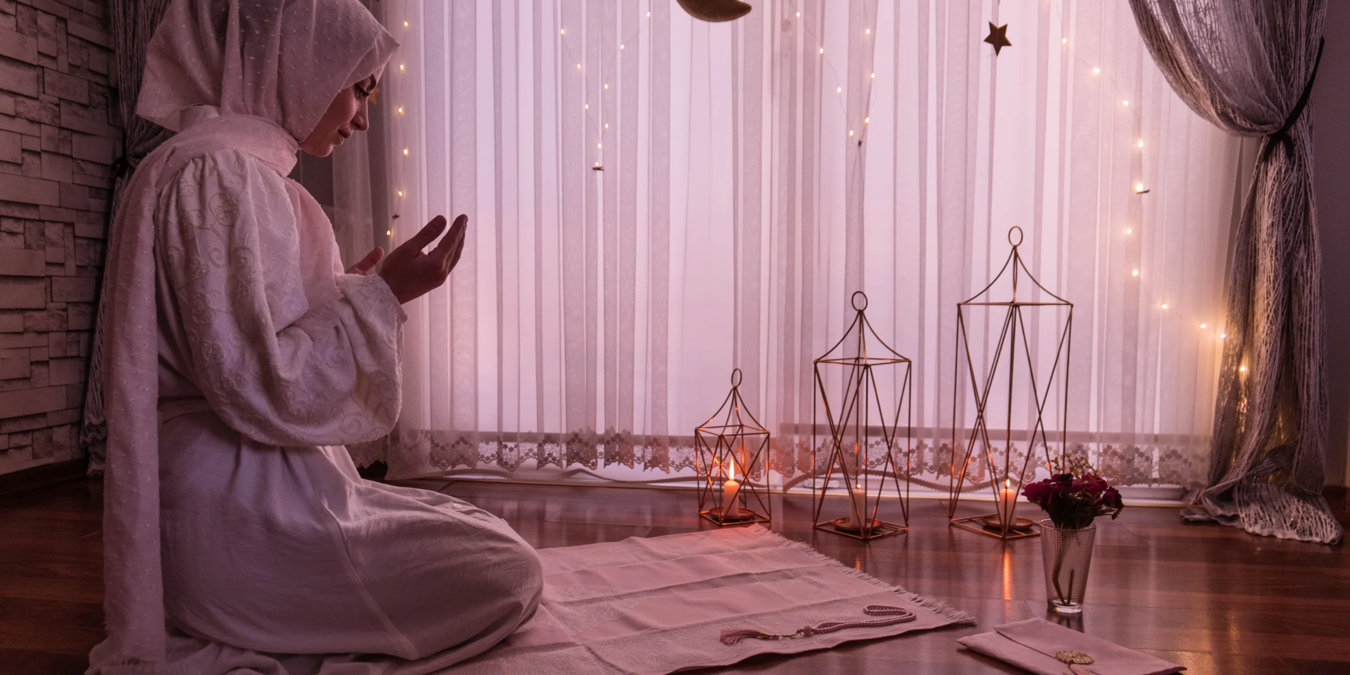 young Muslim woman praying in decorated space