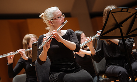 students playing flutes in concert