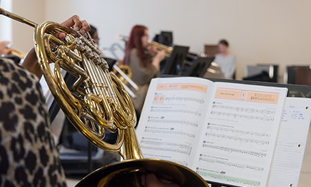 schulich school of music student playing french horn