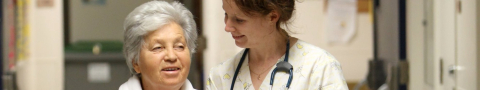 Patient and nurse smiling and talking