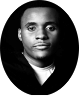 black and white headshot of handsome man smiling slightly