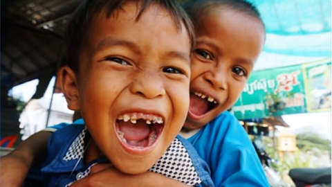 Children smiling showing teeth
