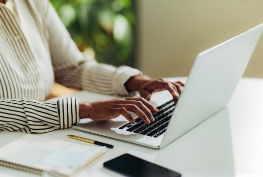 Person typing on a laptop